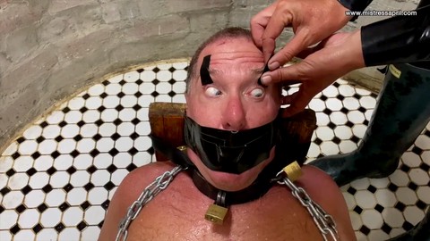 Mistress April, the ruthless dominatrix - Waterboarding her submissive gimp in a thrilling capture session