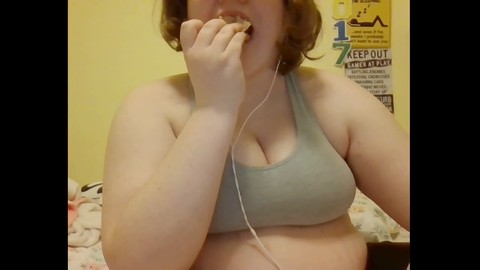 Belly, sports bra, feedee eating